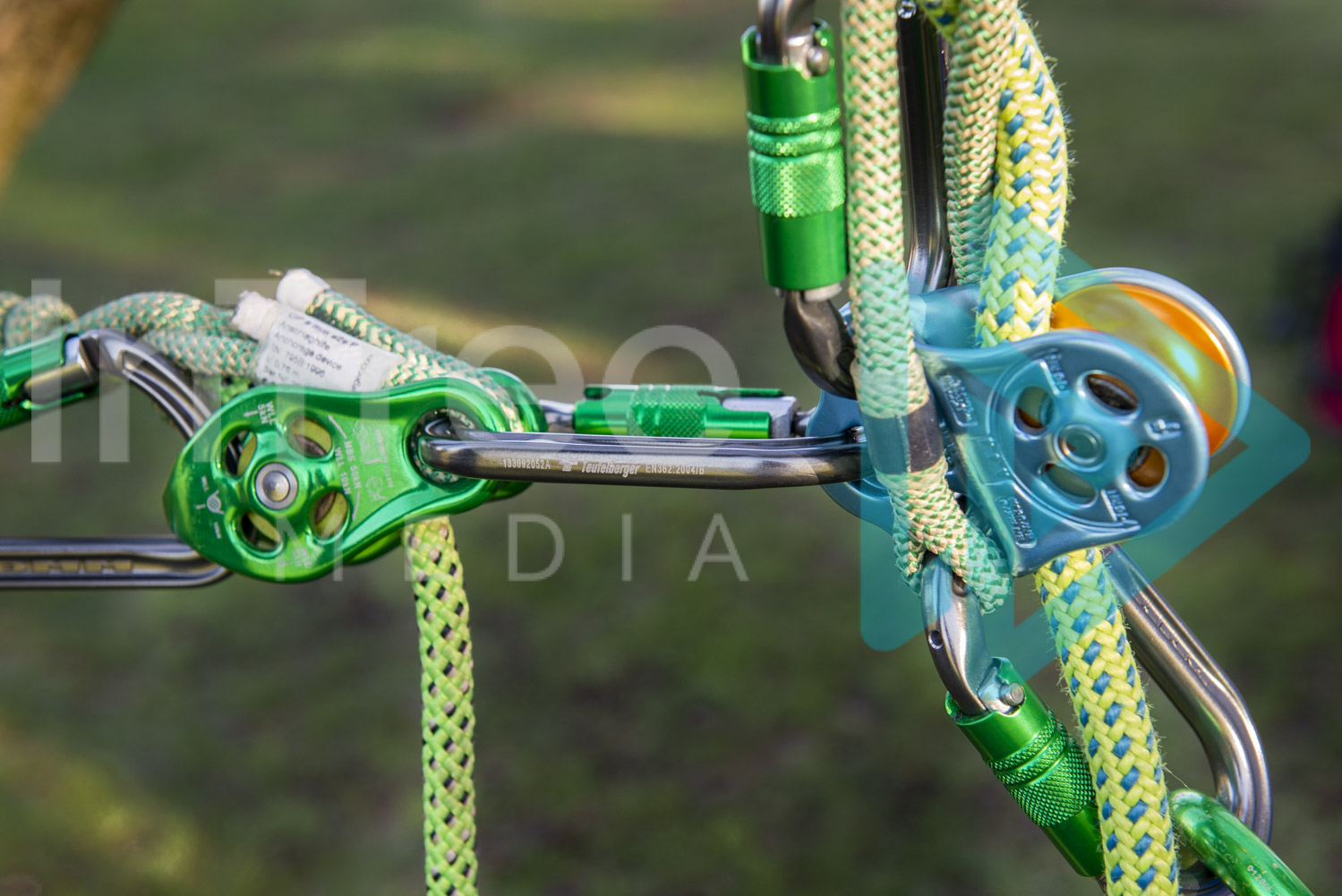 Close up of carabiners and pulleys on rope 001-21-3668