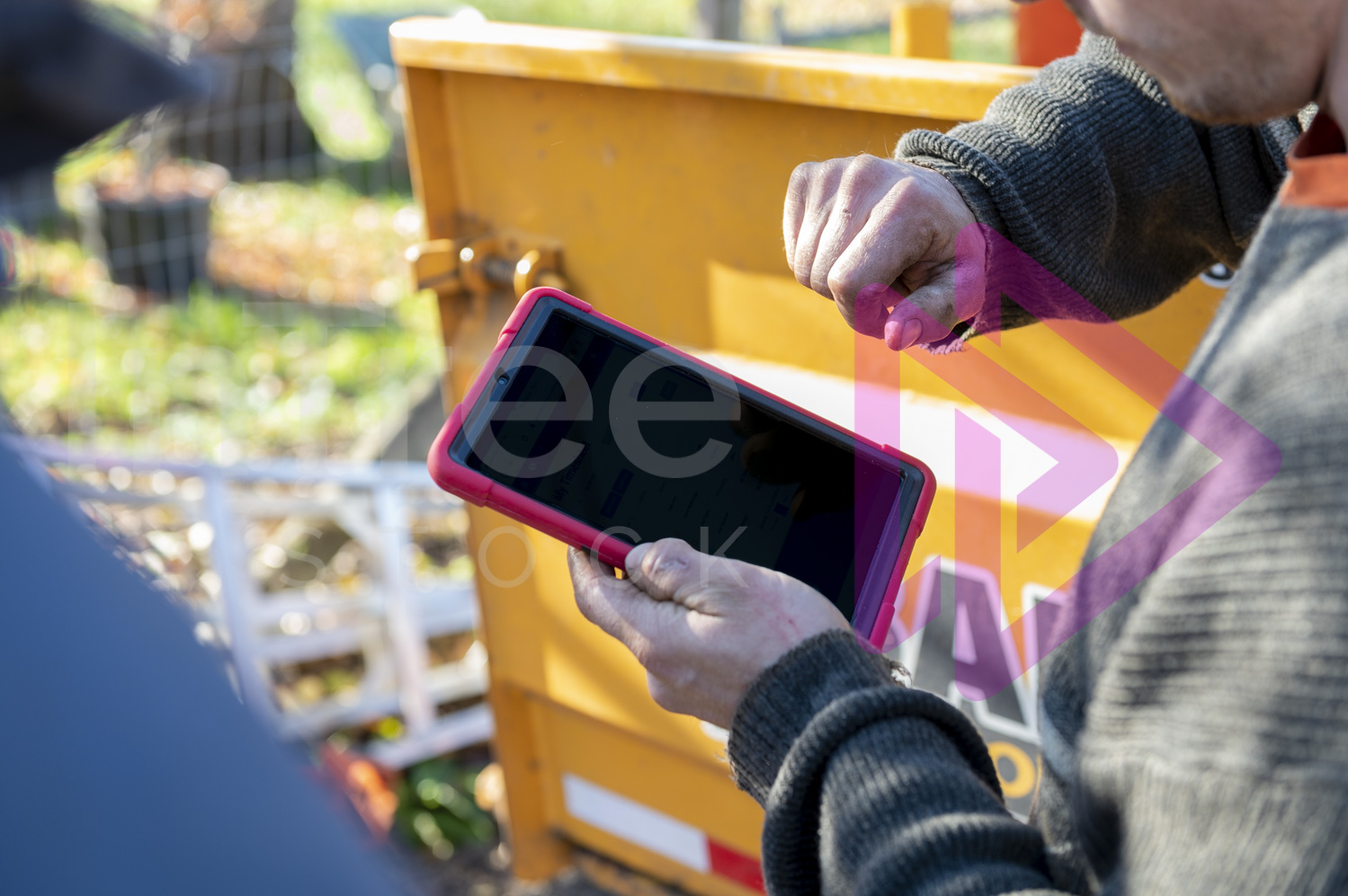 Man operating a tablet with blank screen ready for mock up