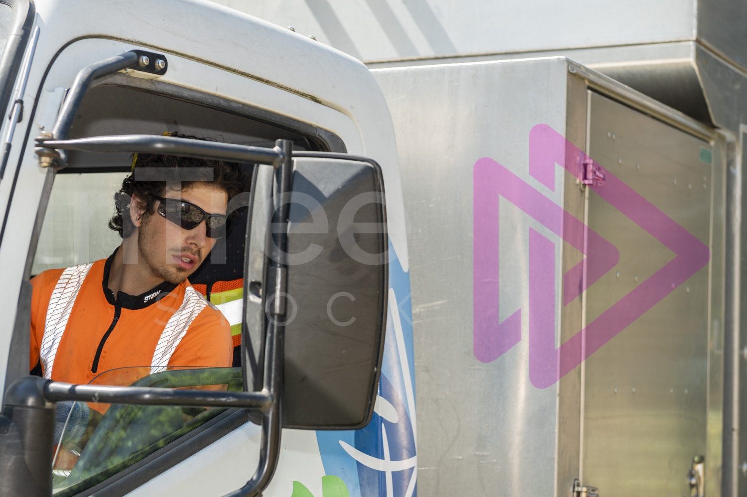 Male arborist reversing chip truck