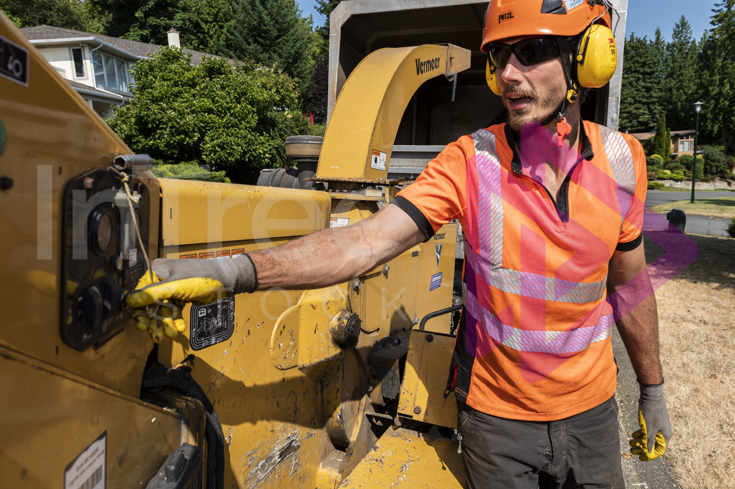 Man turning on Vermeer chipper