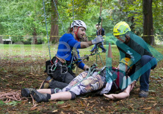 Aerial resuce training ground support receiving casualty from climber