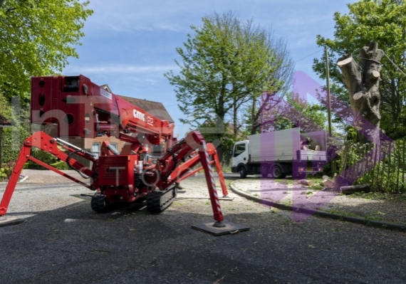 Mobile elevated work platform packed away after removing a sycamore tree