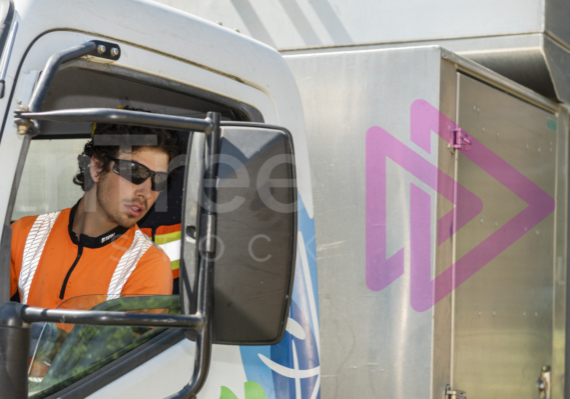 Male arborist reversing chip truck - Arborist Stock photo-001-21-2913 Male arborist reversing chip truck