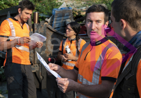 Man holding job sheet talking with crew all wearing hi-viz - Arborist Stock Photo-001-21-3434 Man holding job sheet talking with crew all wearing hi-viz