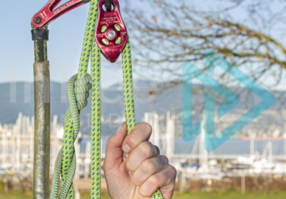 Climbing Arborist demonstrating mechanical advantage on a stationary rope system