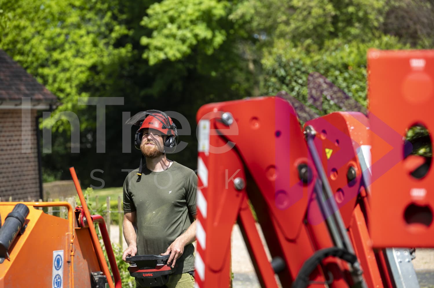 Spider lift operator moving lift with remote control