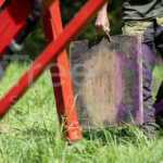 Outrigger pad in ground persons hand